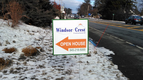Picture of an open house sign outside on State Route 32 at the entrance of Windsor Crest at Highwood Drive
