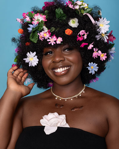 Creative modeling shoot with flowers in afro