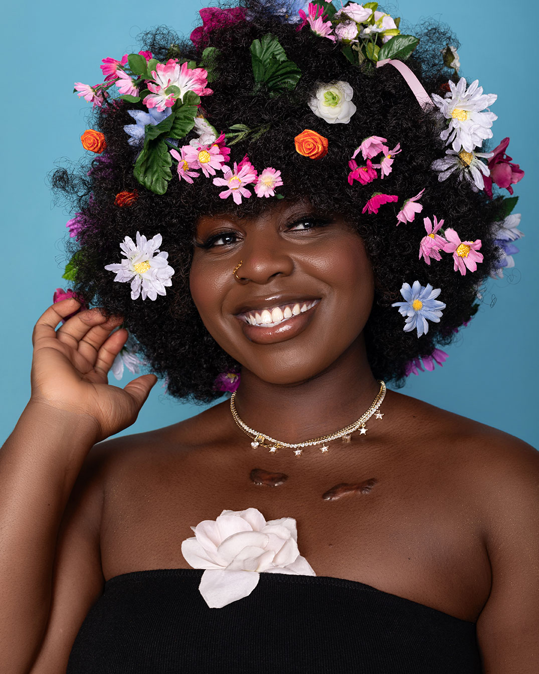 Creative modeling shoot with flowers in afro